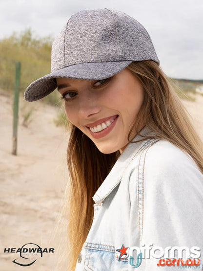 Young woman in textured grey baseball cap and denim jacket, perfect for uniforms or workwear