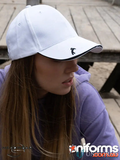 White baseball cap with black trim from Chino Twill with Golf Peak, high imprint style