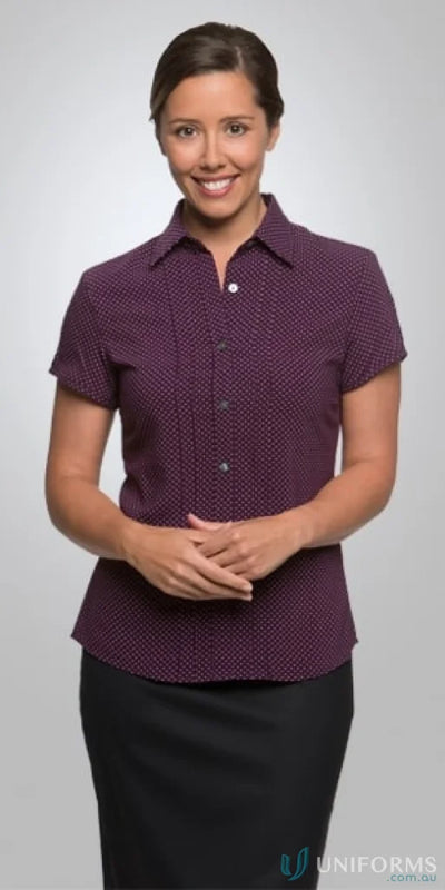 Woman wearing City Stretch Spot Ladies SS Shirt with cap sleeves and natural stretch