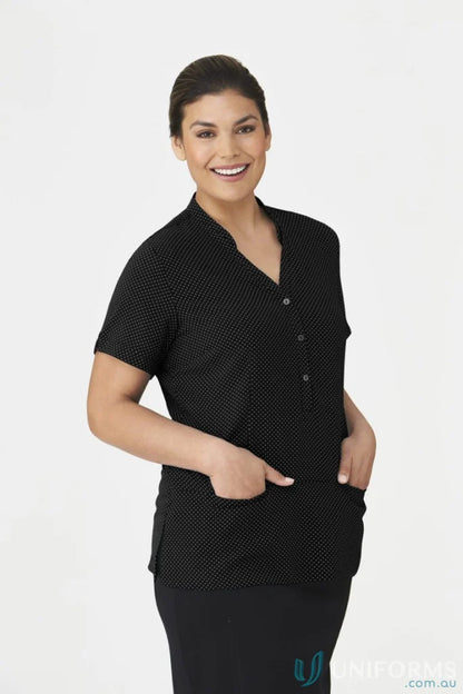 Woman in City Stretch Spot Tunic from City Collection workwear with black blouse and skirt