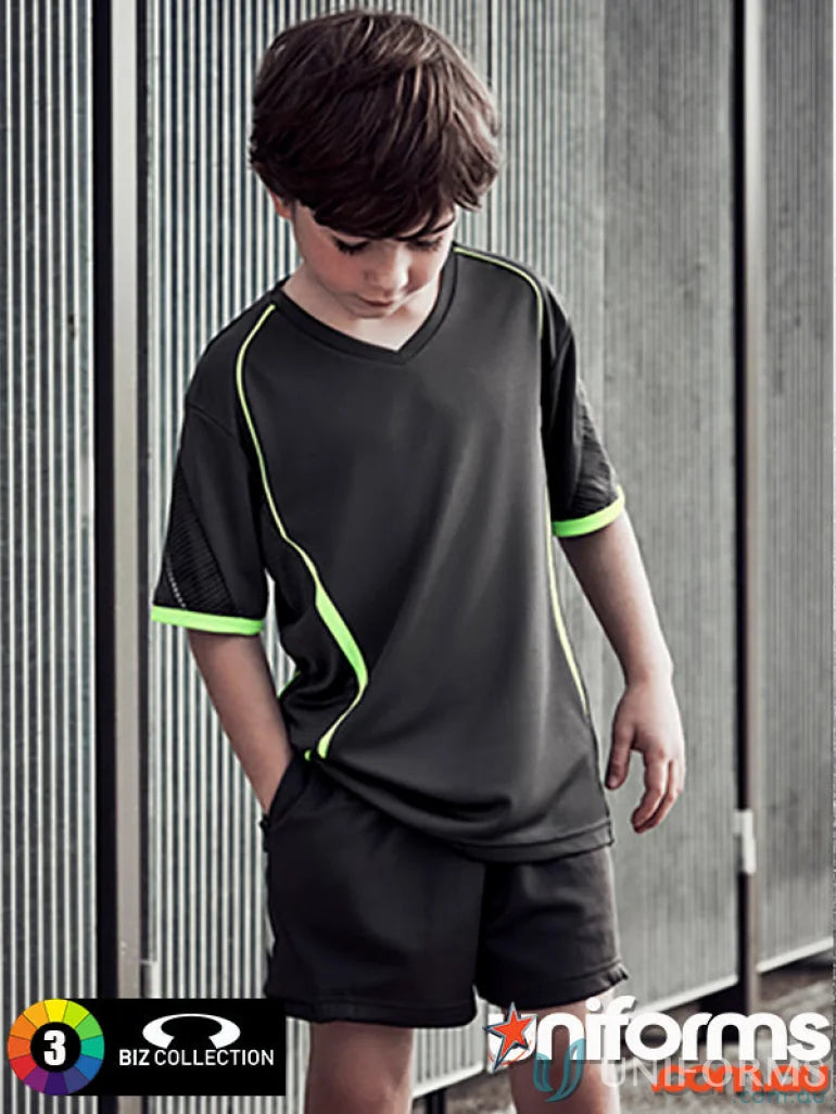 Young boy wearing CLEARANCE Circuit Kids Shorts with neon green accents and silver reflective trims