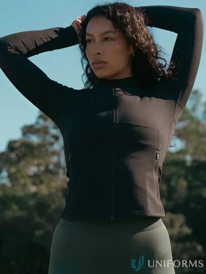 Woman in black Contour Zip Jacket with high neck collar and cover stitching design