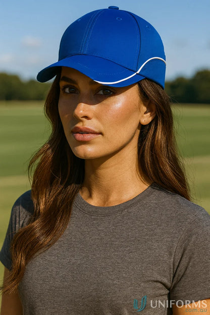 Woman modeling a blue Contrast Lining Cap with white trim and dark gray T-shirt