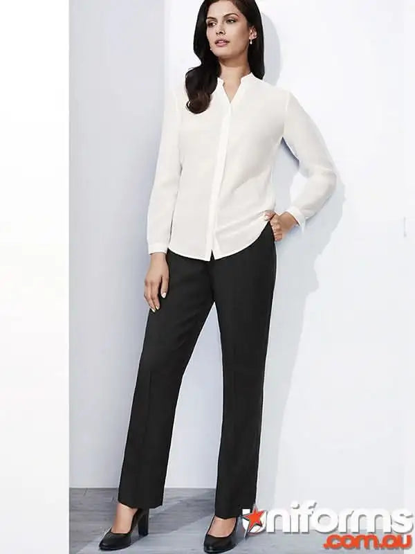 Woman wearing cool stretch easy fit straight leg waist pant in white shirt and black trousers