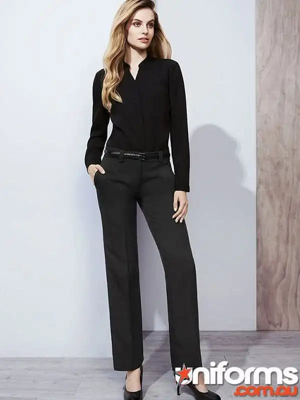 Woman modeling black long-sleeved top and trousers in cool stretch hipster fit workwear