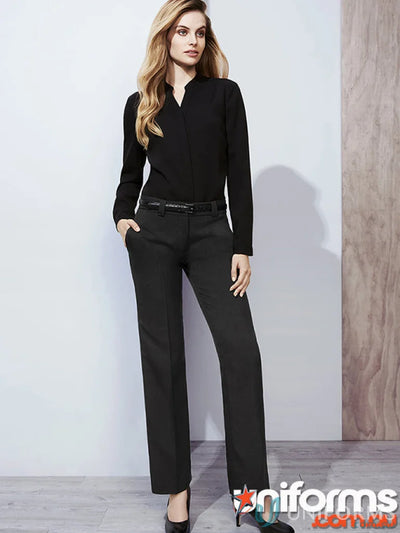 Woman modeling black long-sleeved top and trousers in cool stretch hipster fit workwear