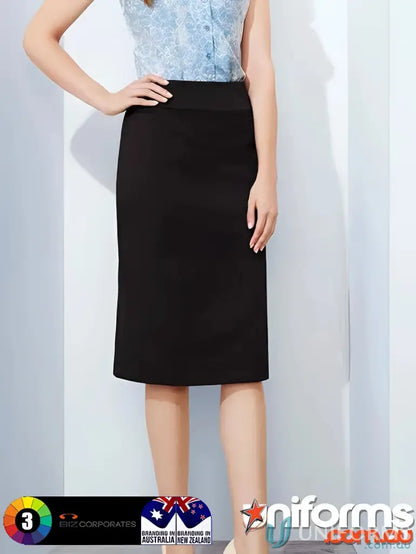 Woman modeling women’s cool stretch relaxed fit lined black pencil skirt with blue pattern shirt