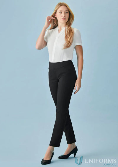 Woman in white blouse and black bandless slim leg pant showcasing cool stretch style