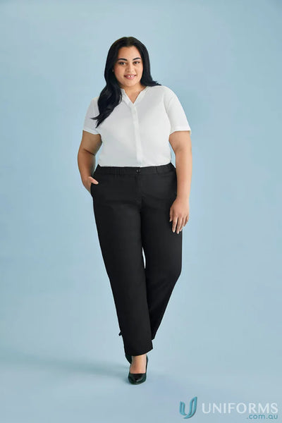 Woman in white blouse and black pants showcasing Cool Stretch Ultra Comfort Waist Pant