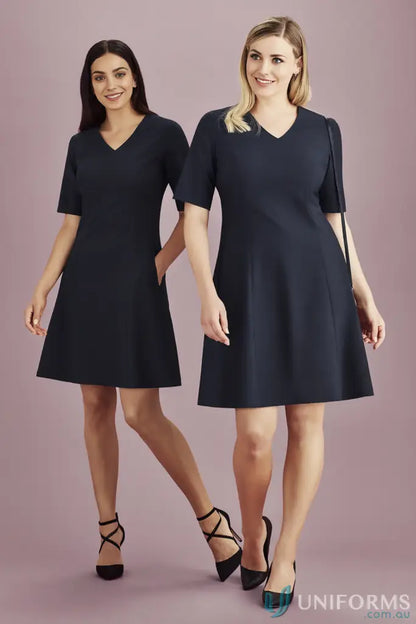 Two women modeling stylish dark-colored V-neck dresses perfect as work uniforms or workwear