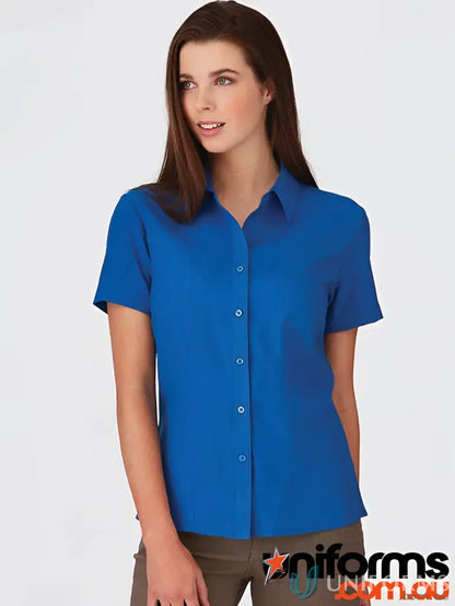 Woman wearing CR EM Ladies Ezylin SS Shirt, a stylish workwear short-sleeve uniform