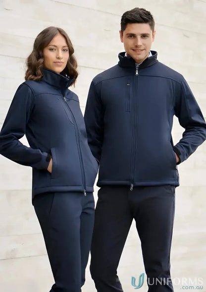 Man and woman in matching navy blue mens softshell jackets j3880 made with Biz Tech fabric
