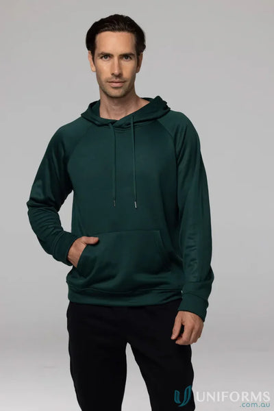 Man in green hoodie and black pants showcasing Crusader Fleece for comfortable fit