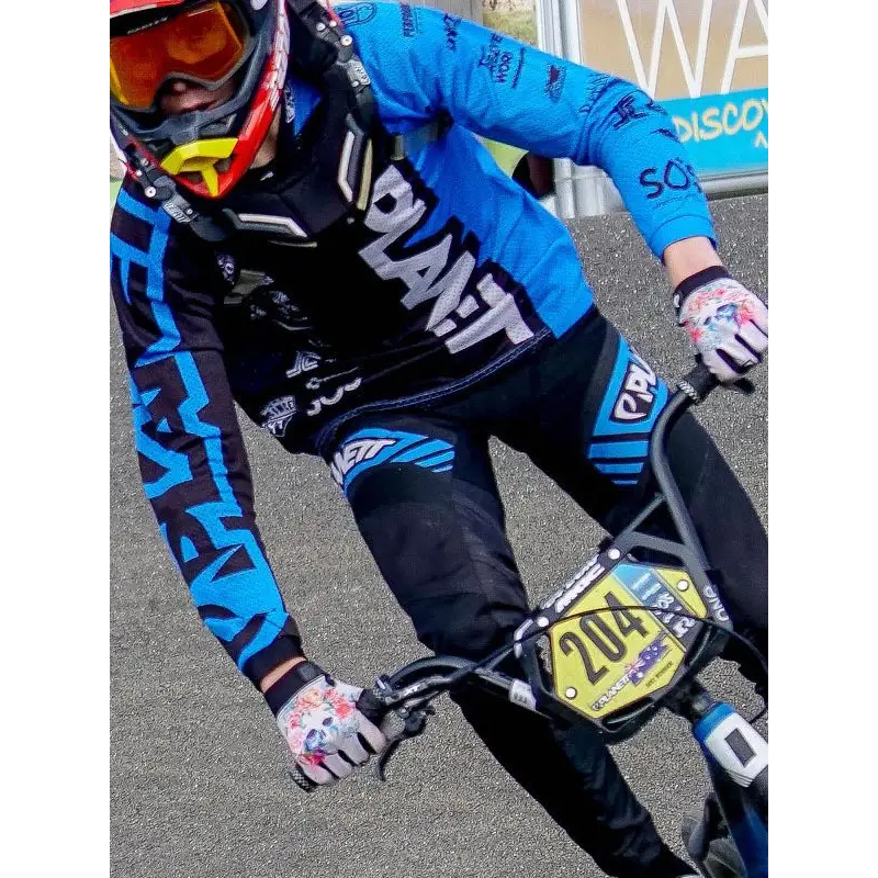Blue and black motocross jersey with white lettering paired with custom av8 ride pant ideal for work uniforms and workwear