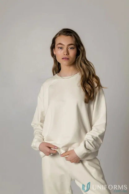 Woman in matching cream Archie Crew Sweat and pants showing cozy Archie Crew Sweat look