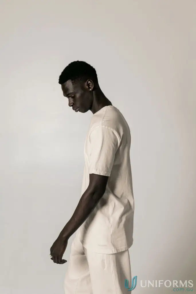 Man in beige Bobby Tee PFD with regular fit and nameless CB embroidery