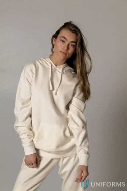 Woman wearing a Hudson Oversized Cotton Hoodie in garment dyed cream for comfy uniforms
