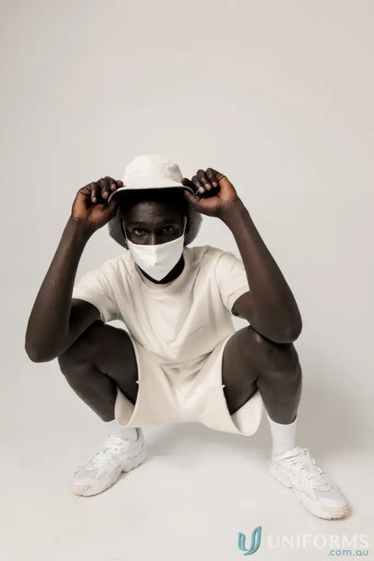 Man in matching white outfit wearing Retro Fit Donald Tee with higher ribbed neckline