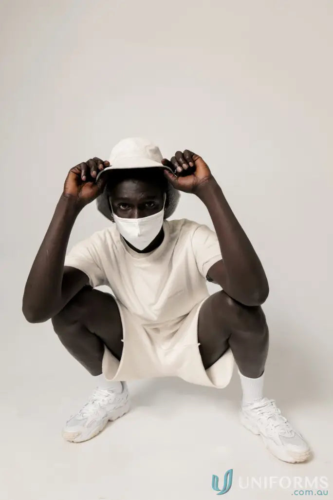 Man in matching white outfit wearing Retro Fit Donald Tee with higher ribbed neckline