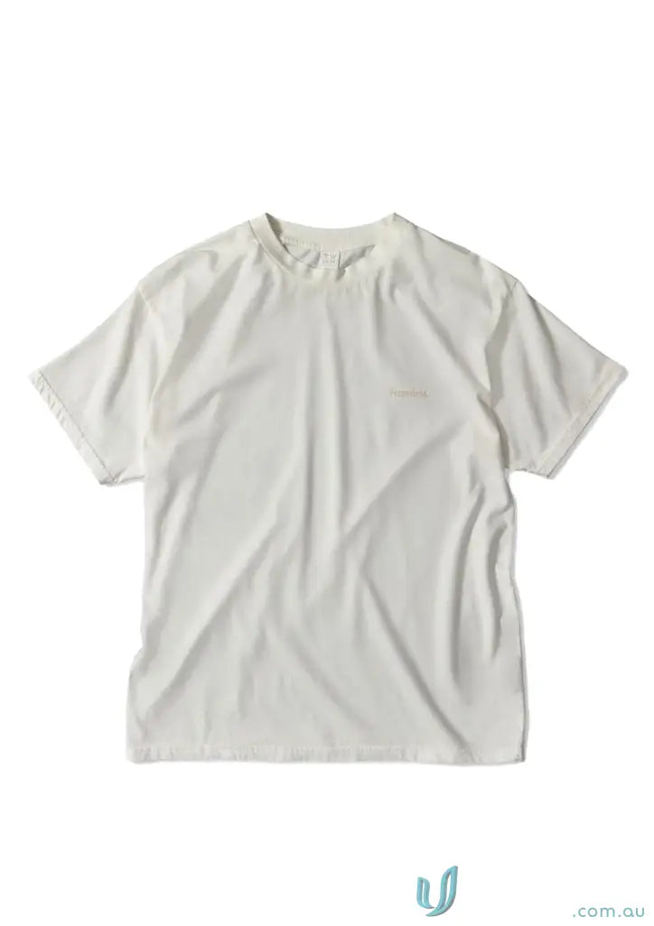 Wrinkled off-white Donald Tee with retro fit and higher ribbed neckline for casual vibe