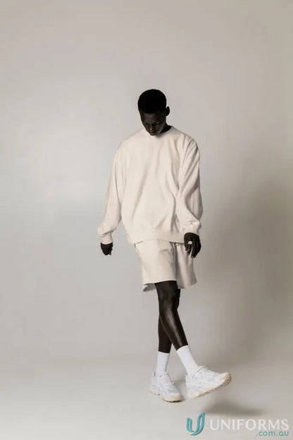 Man in matching Retro Sweat Natural Dyed oversized drop shoulder sweatshirt and shorts