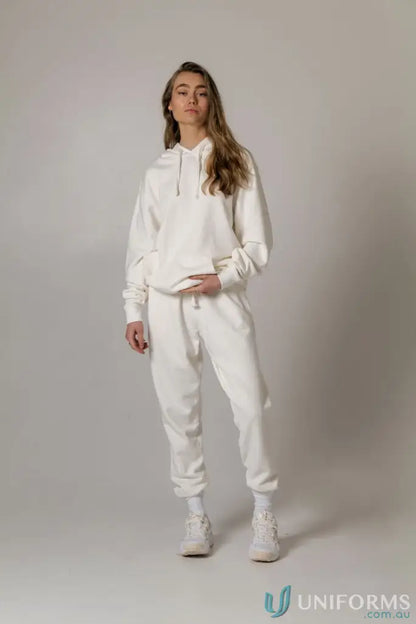 Woman in white brushed French terry Tommy Trackpant PFD made from soft French terry material