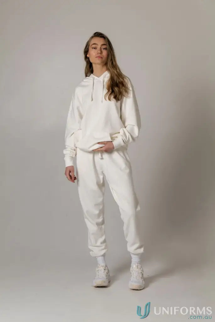 Woman in white brushed French terry Tommy Trackpant PFD made from soft French terry material