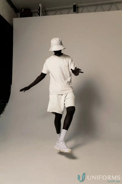 Man in white Tommy Trackshort dancing, perfect for uniforms and workwear style