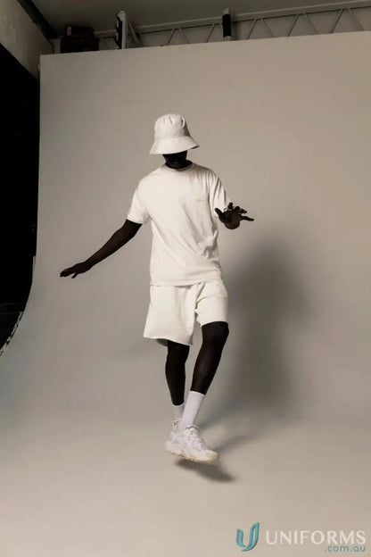 Man in white Tommy Trackshort dancing, perfect for uniforms and workwear style