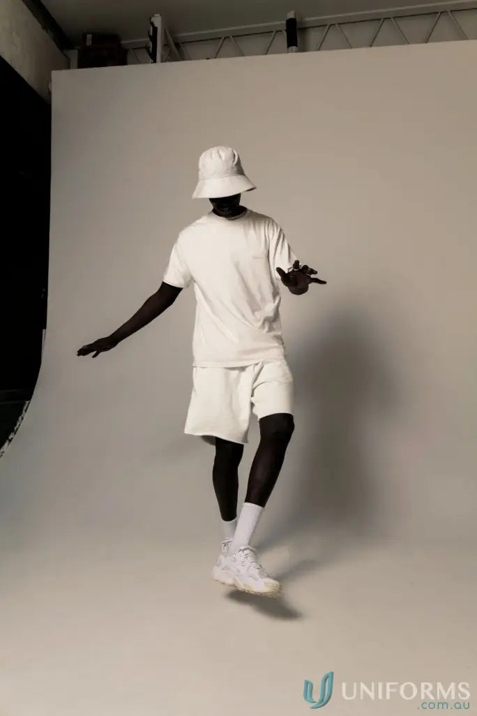 Man in white Tommy Trackshort dancing, perfect for uniforms and workwear style