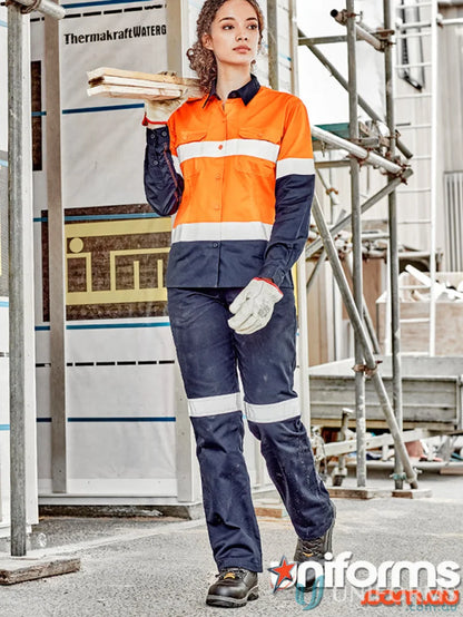 Woman wearing Syzmik Womens Taped Utility Pant with reflective tape for safety