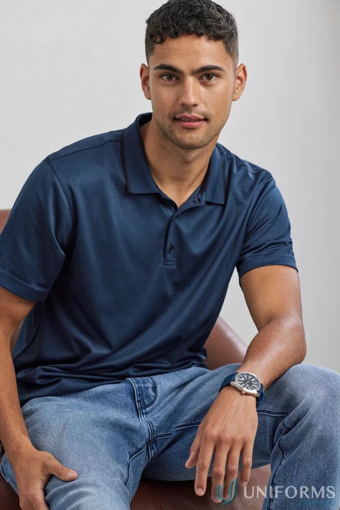 Echo Polo man in navy polo shirt and jeans, perfect workwear uniforms made from recycled polyester