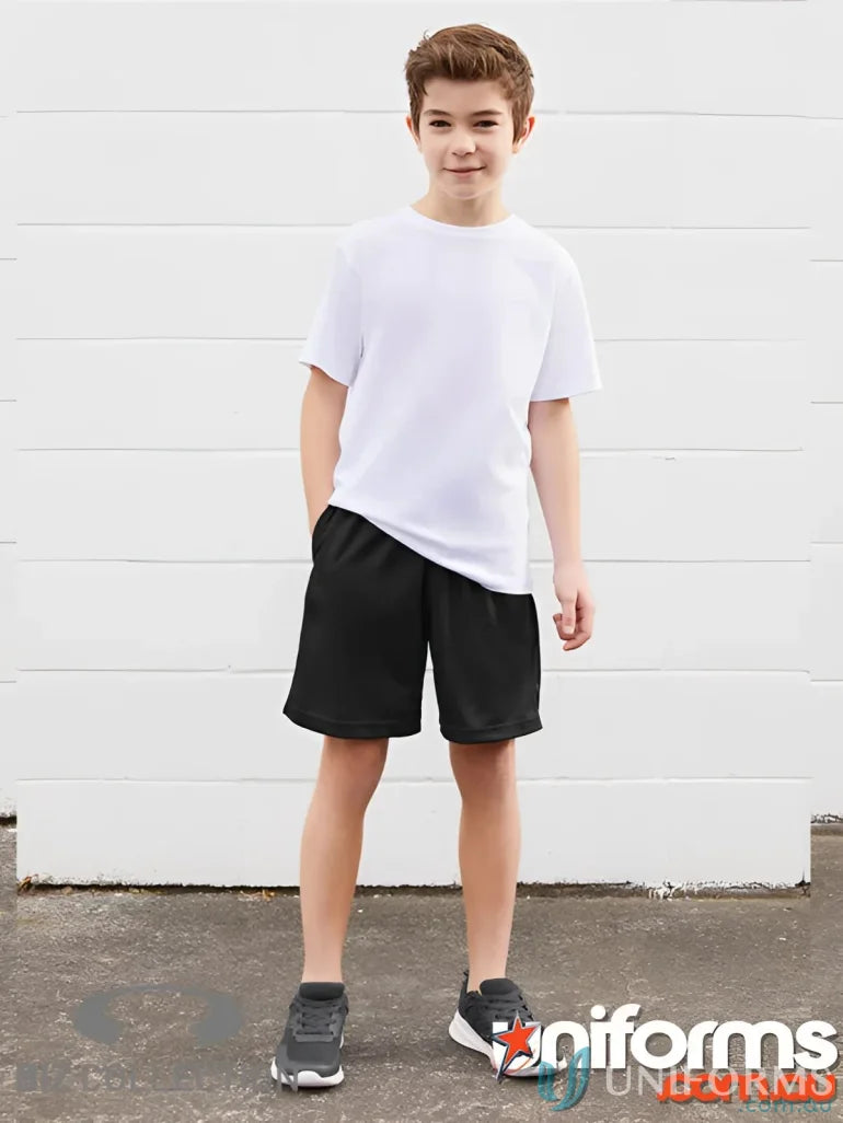 Boy wearing Biz Collection Elite tailored fit polo short sleeve polo in white and black