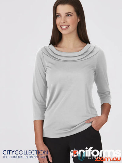 Woman wearing Eva Knit 3Q Top in gray showcasing cozy knit style and Eva Knit fashion
