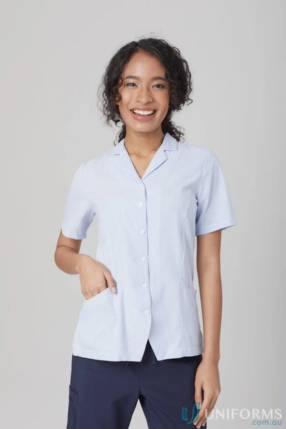 Woman wearing Ezylin Dual Pocket Stripe Shirt in light blue for workwear or uniforms