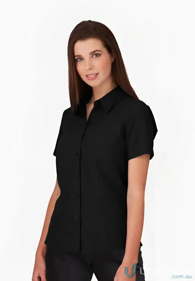 Woman in black workwear wearing Ezylin Ladies S/S Shirt for uniforms or work uniforms