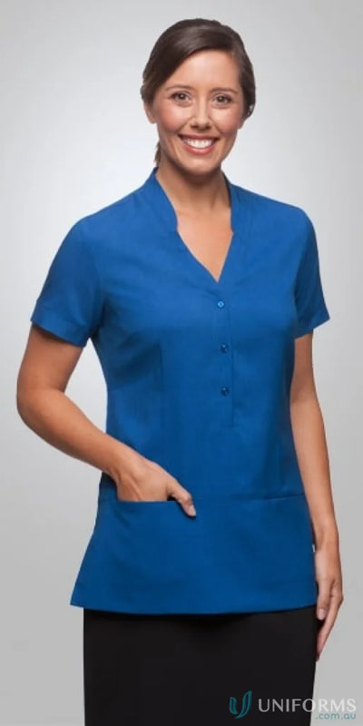 Woman in a blue breathable polyester Ezylin Tunic, perfect for uniforms and workwear