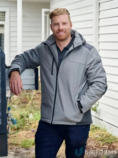 Smiling man in Flx & Move Shield Jacket with waterproof rating and abrasion-resistant panels