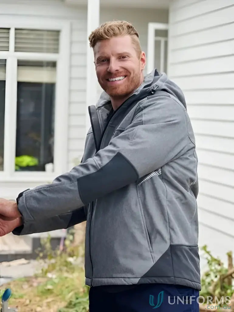 Man wearing Flx & Move Shield Jacket with waterproof rating and abrasion-resistant panels