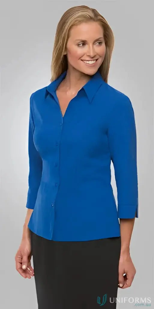 Woman in blue button-down shirt from FMIG EMB Ladies Ezylin 3Qtr Shirt work uniforms