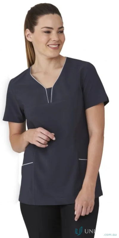 Woman in navy blue scrub top from the fabulous city collection, comfy and stylish