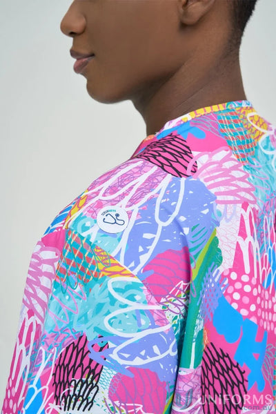 Person wearing vibrant gliding bunjil inclusive top with playful abstract pattern