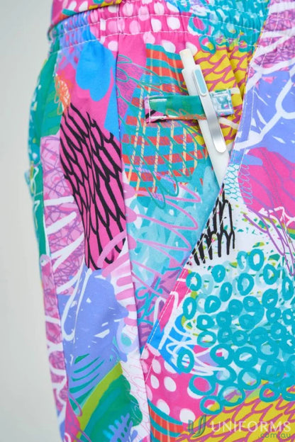 Colorful patterned Gliding Bunjil Pant from Collection Gliding Bunjil with pen for healthcare pros