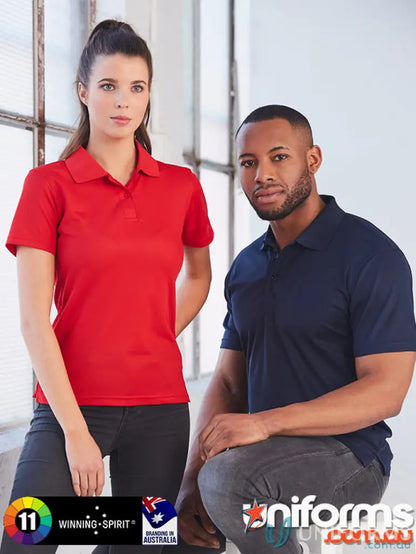 Two models wearing red and navy blue Spirit Ladies Verve polos in PS82 Verve style