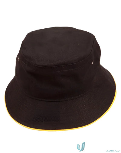 Black bucket hat with yellow trim made of heavy brushed cotton for a casual look