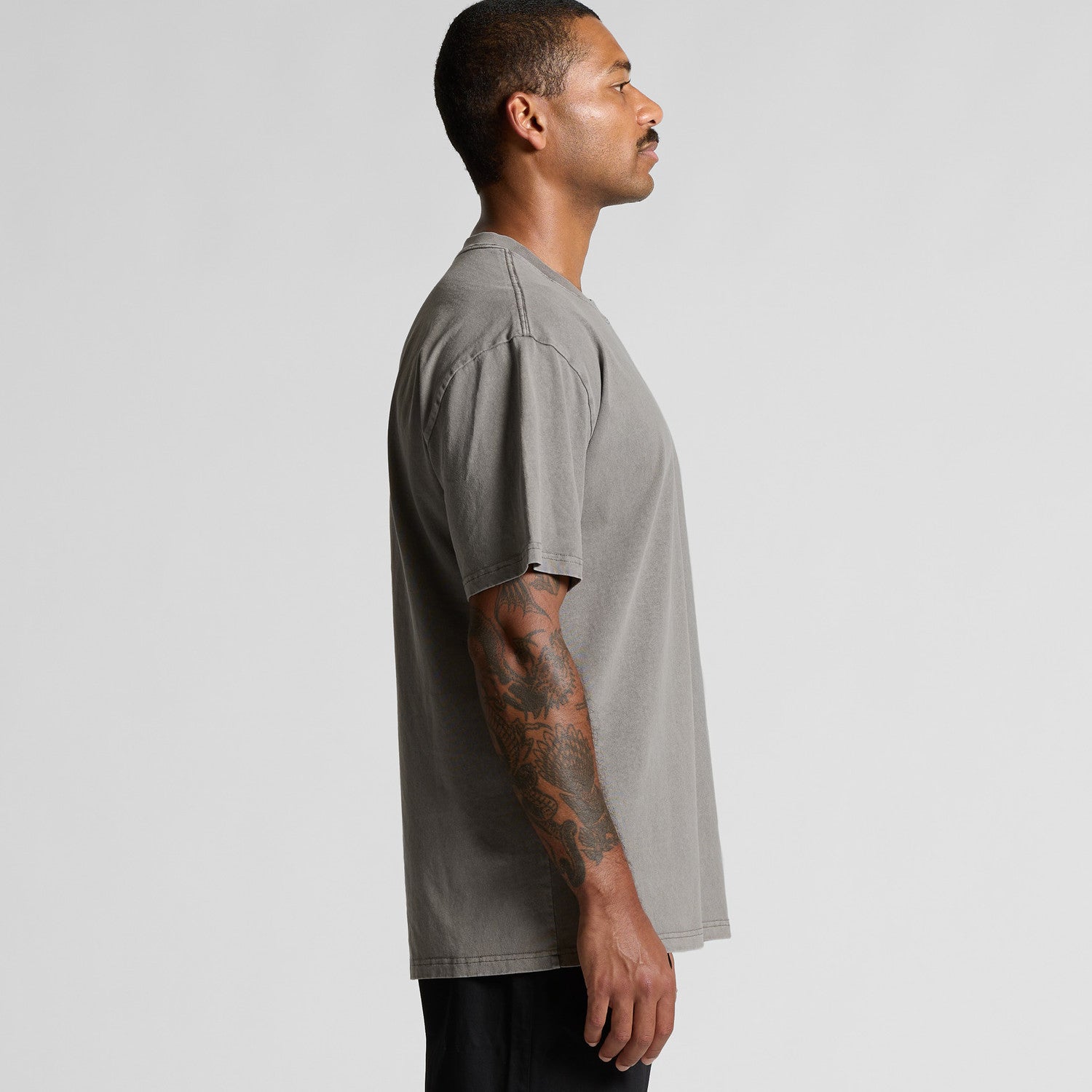 Olive green oversized t-shirt with short sleeves and a relaxed fit.