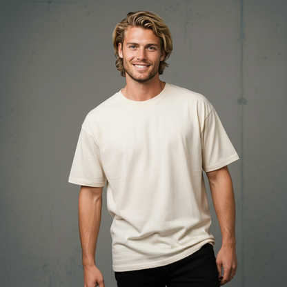Cream-colored crew neck t-shirt with black pants and blonde hair.