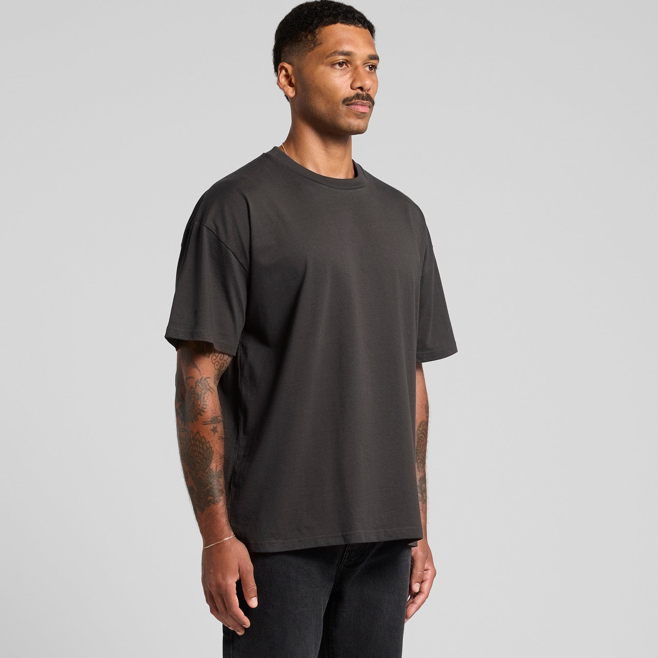 Charcoal gray oversized t-shirt with a relaxed fit and crew neck design.