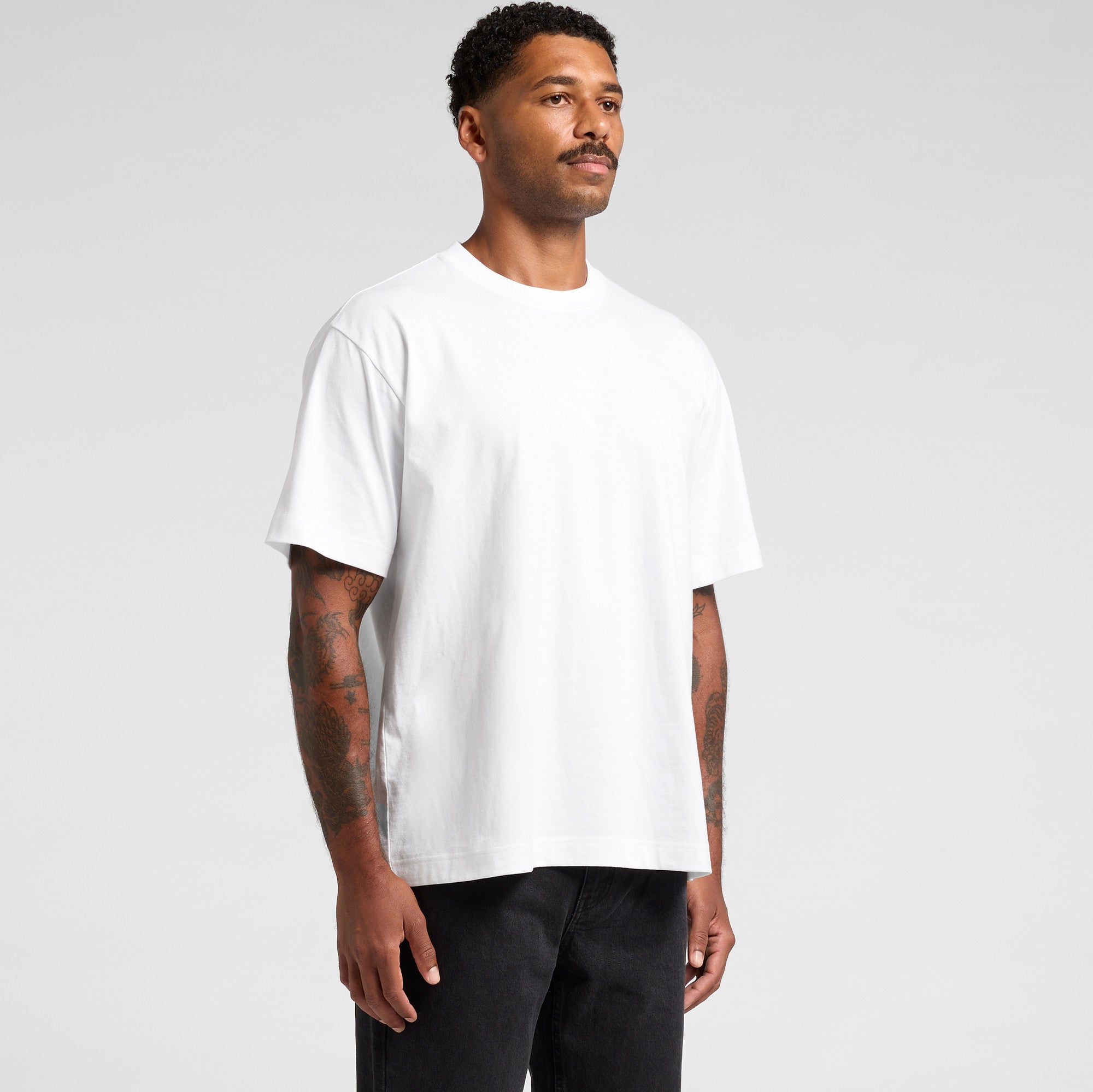 White crew neck t-shirt with short sleeves and a relaxed fit.