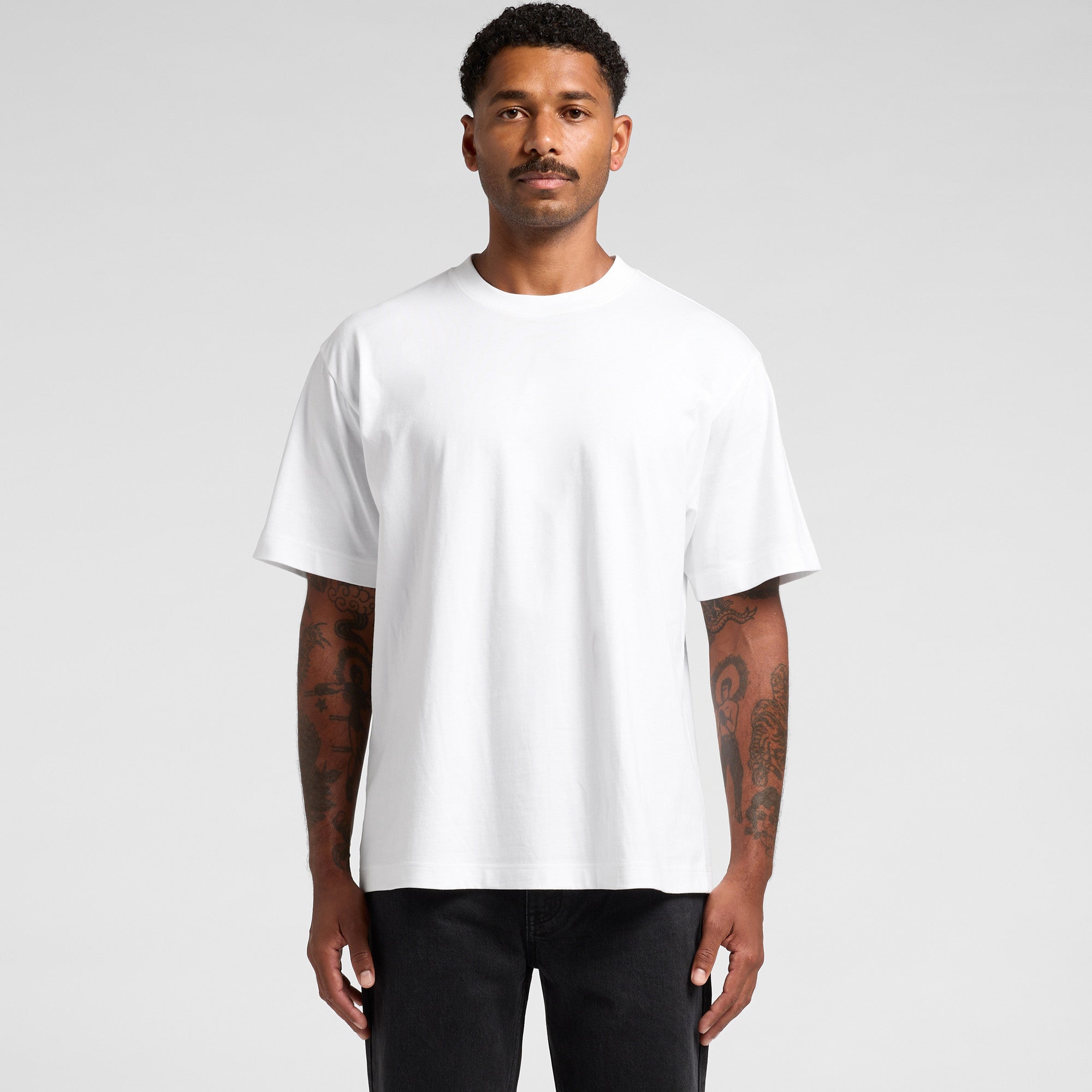 White crew neck t-shirt with short sleeves and a relaxed fit.